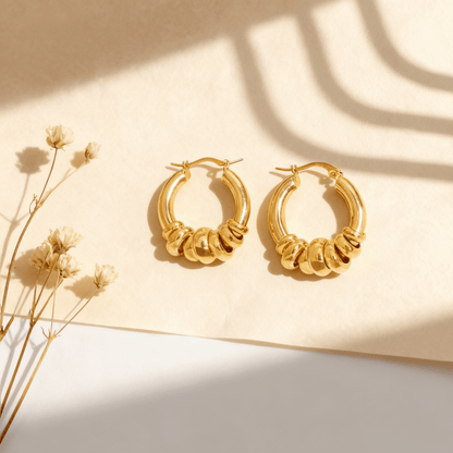 A pair of all-gold Siena Stacked Hoops, highlighting the textural, multi-ring design and high-shine 18K gold finish.