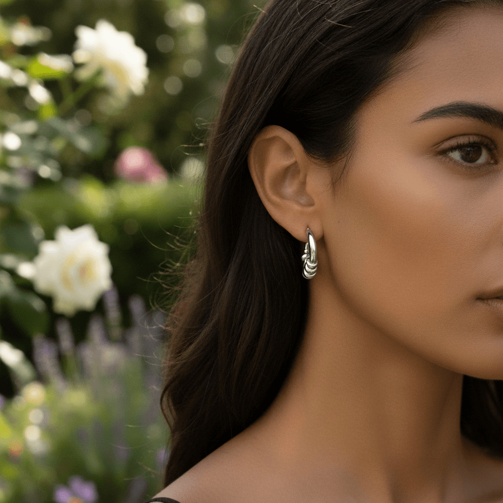 Model wearing the silver Siena Hoops to show their medium size and how they perfectly complement a modern, stylish look.