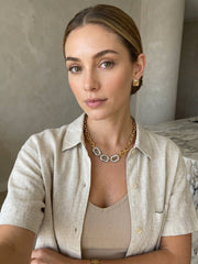 Gold and silver chunky chain necklace worn in lifestyle portrait