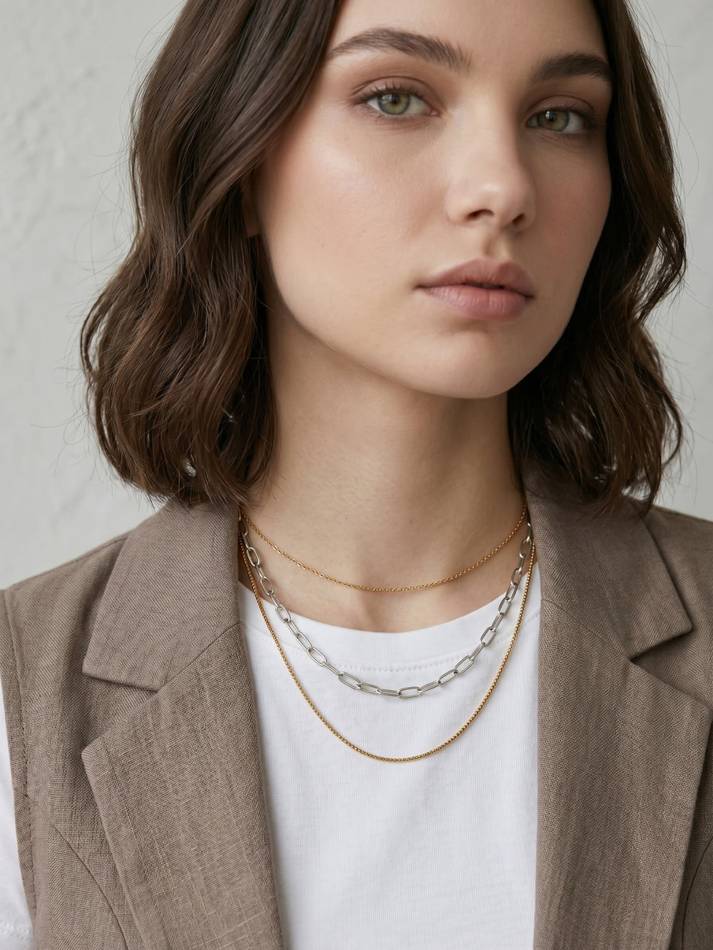 Gold and silver mixed chain necklace styled on model