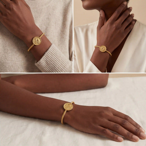Model with dark skin styling gold roman coin bangle bracelet vintage aesthetic.