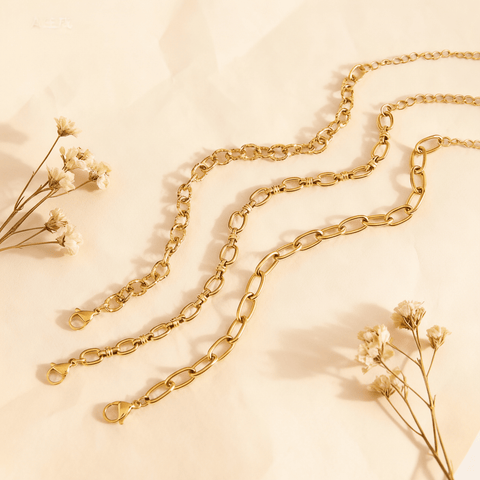The three most delicate chain bracelets from The Amalfi Layering Set arranged in a graceful, flowing wave pattern, perfect for a minimalist jewelry look.