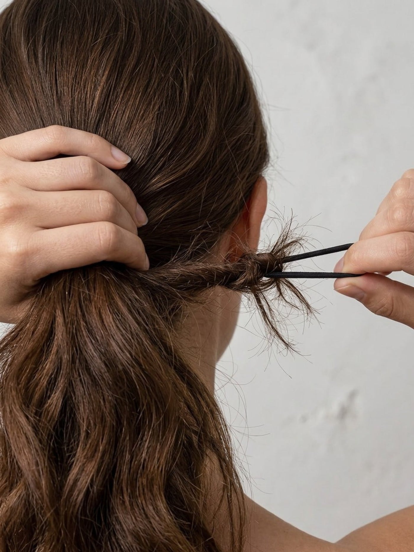 Hair tied up with a scrunchie