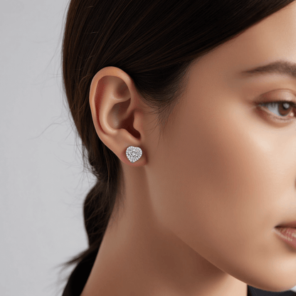 Gleaming Heart Moissanite Earrings — sterling silver heart-shaped stud earrings with sparkling moissanite, romantic and elegant gift.