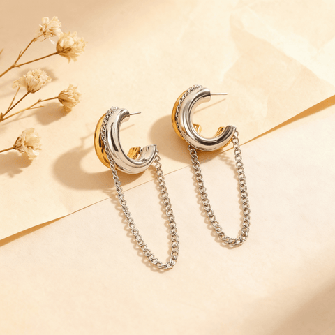Luxe Layered Chain Hoops in two-tone gold and silver with a chunky C-shape and a dangling silver chain.
