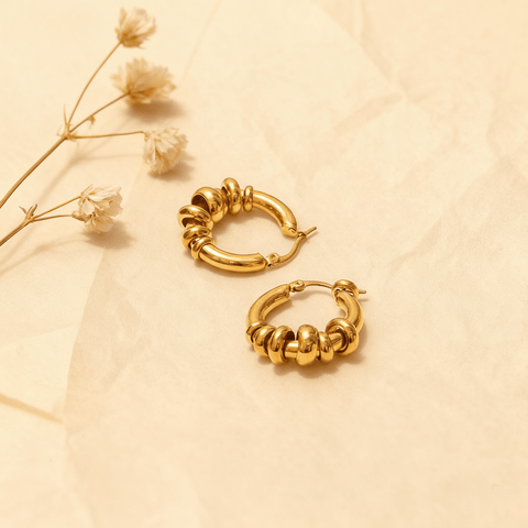 A pair of all-gold Siena Stacked Hoops, highlighting the textural, multi-ring design and high-shine 18K gold finish.