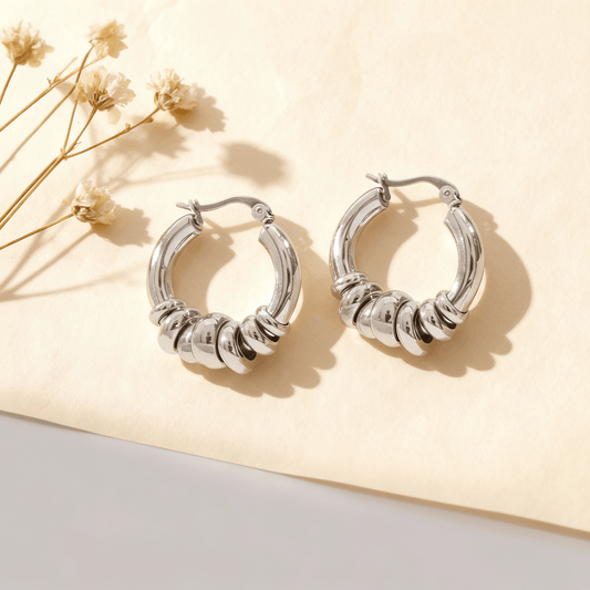 A pair of Silver Siena Stacked Hoops, highlighting the textural, multi-ring design and polished finish.