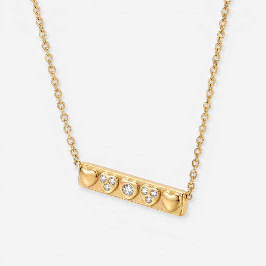 Gold horizontal bar pendant necklace with heart motif waterproof stainless steel.