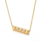 Gold horizontal bar pendant necklace with heart motif waterproof stainless steel.