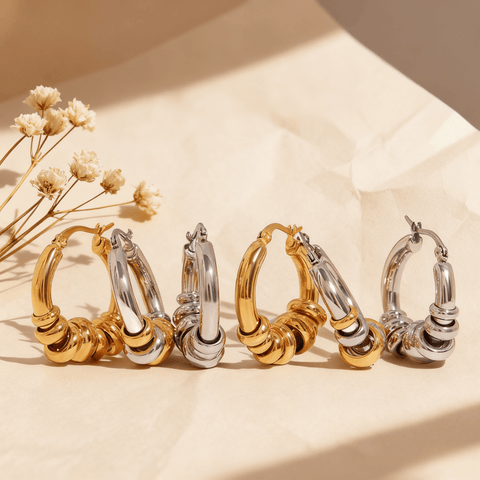 Three pairs of the Siena Stacked Hoops in 18K gold, polished silver, and a two-tone mixed metal finish, displayed together on a white background.