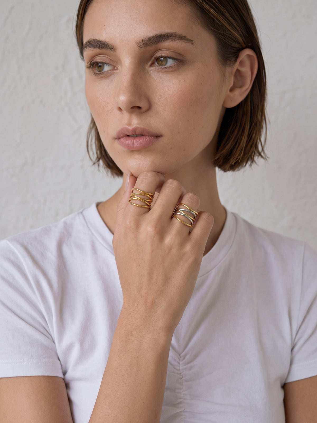 Ariadne Ring styled on the hand with a sculptural multi-band stacked look