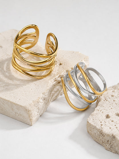 Close-up of the Ariadne Ring showing its flowing crossover bands and open ring design