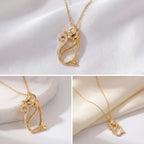 Aesthetic product photography details of gold crystal cat necklace on white silk background.