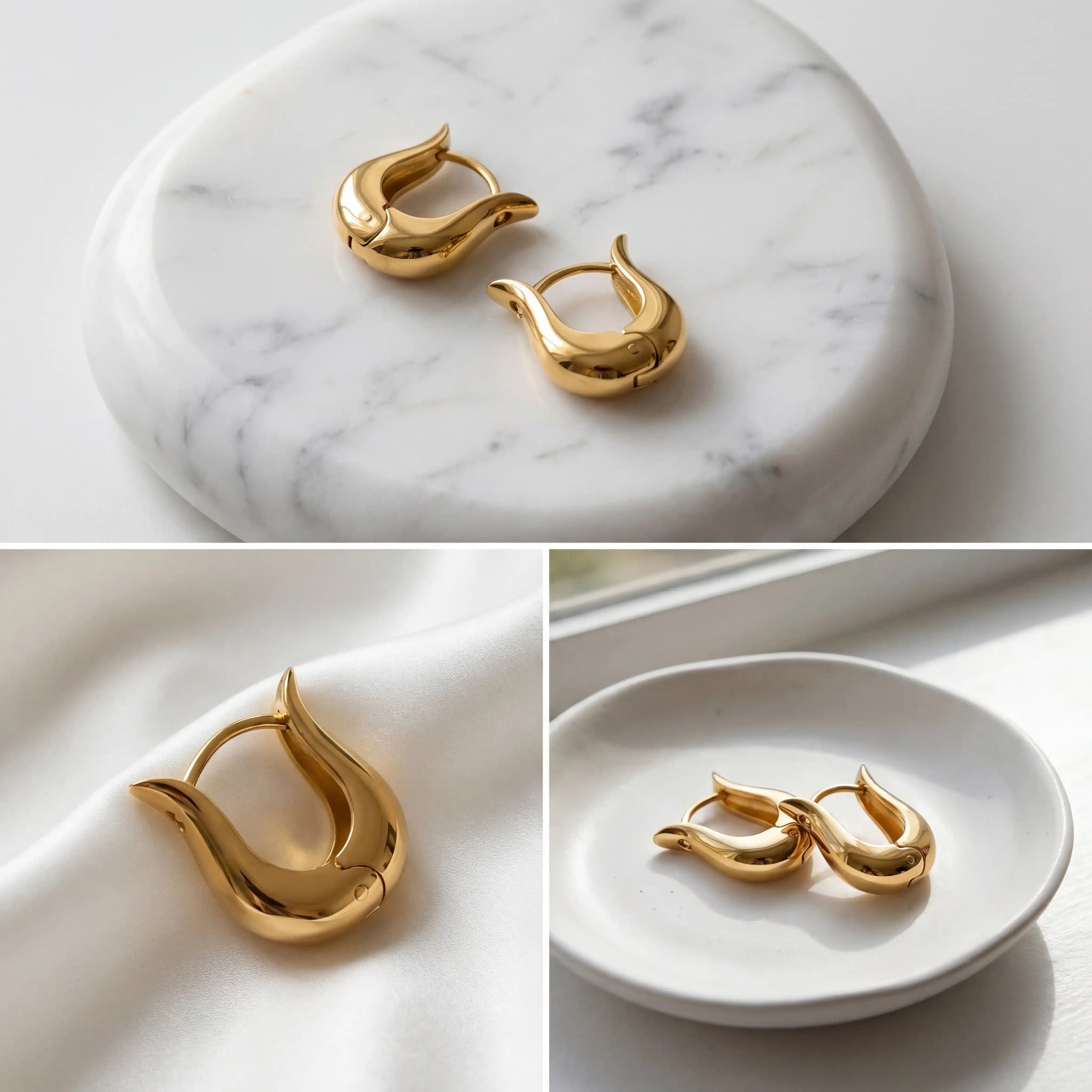 Aesthetic product photography details of thick gold U-hoops on white stone background.