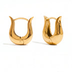 Pair of gold tapered U-hoops with organic calla lily shape waterproof stainless steel.