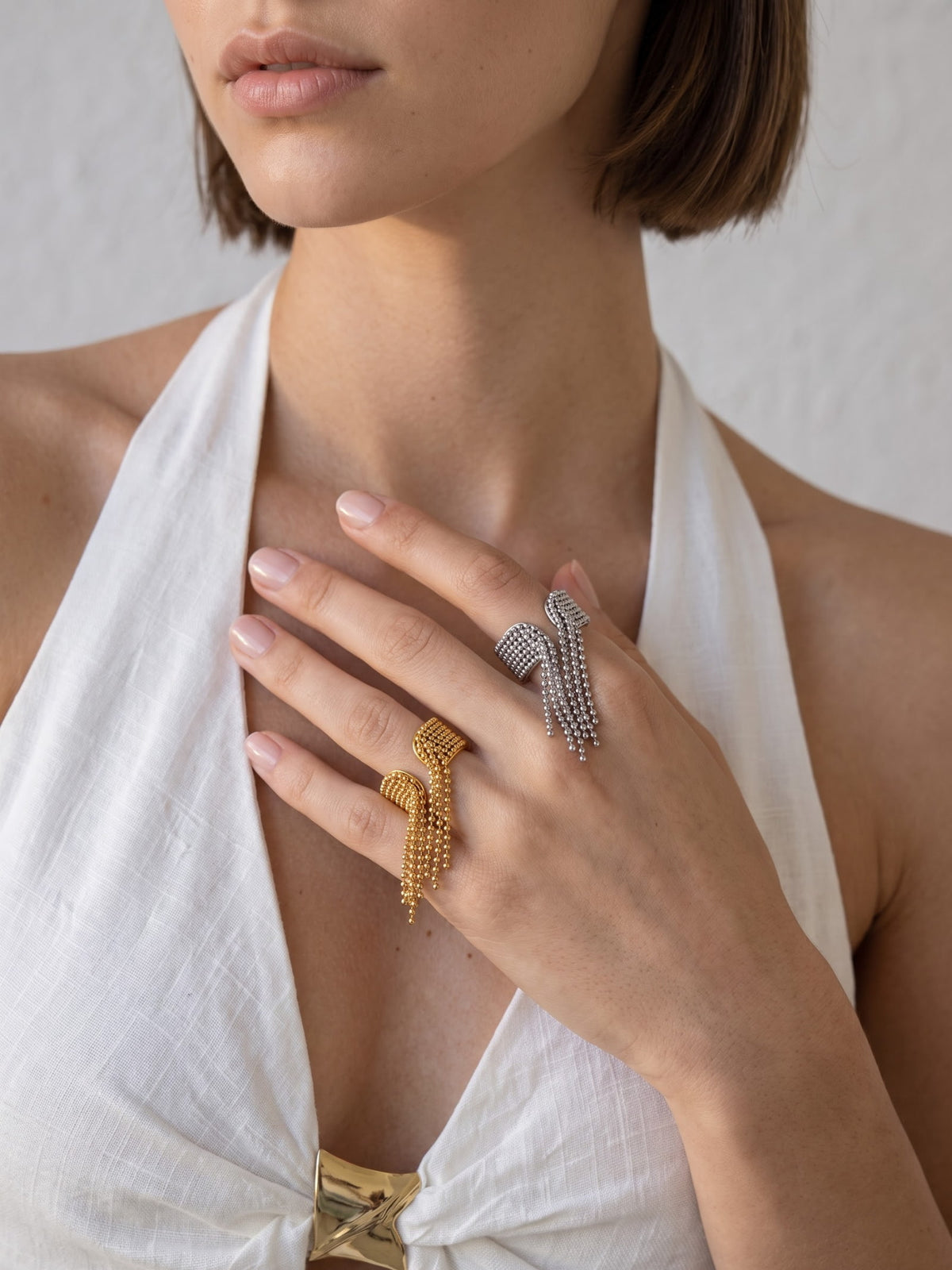 Danaë chain fringe ring worn on hand, highlighting the cascading ball-chain texture