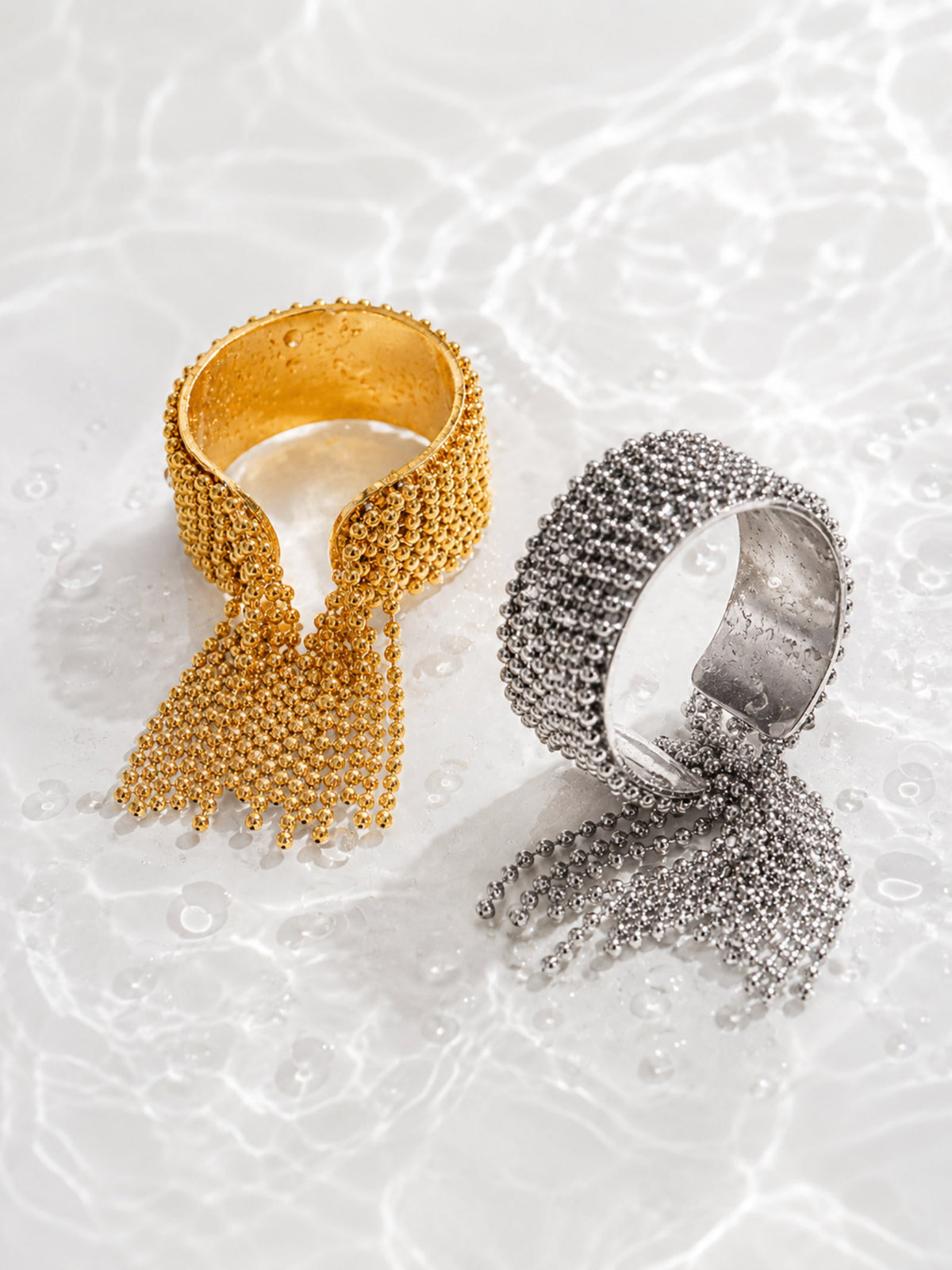 Danaë chain fringe statement ring with smooth band and cascading ball-chain fringe