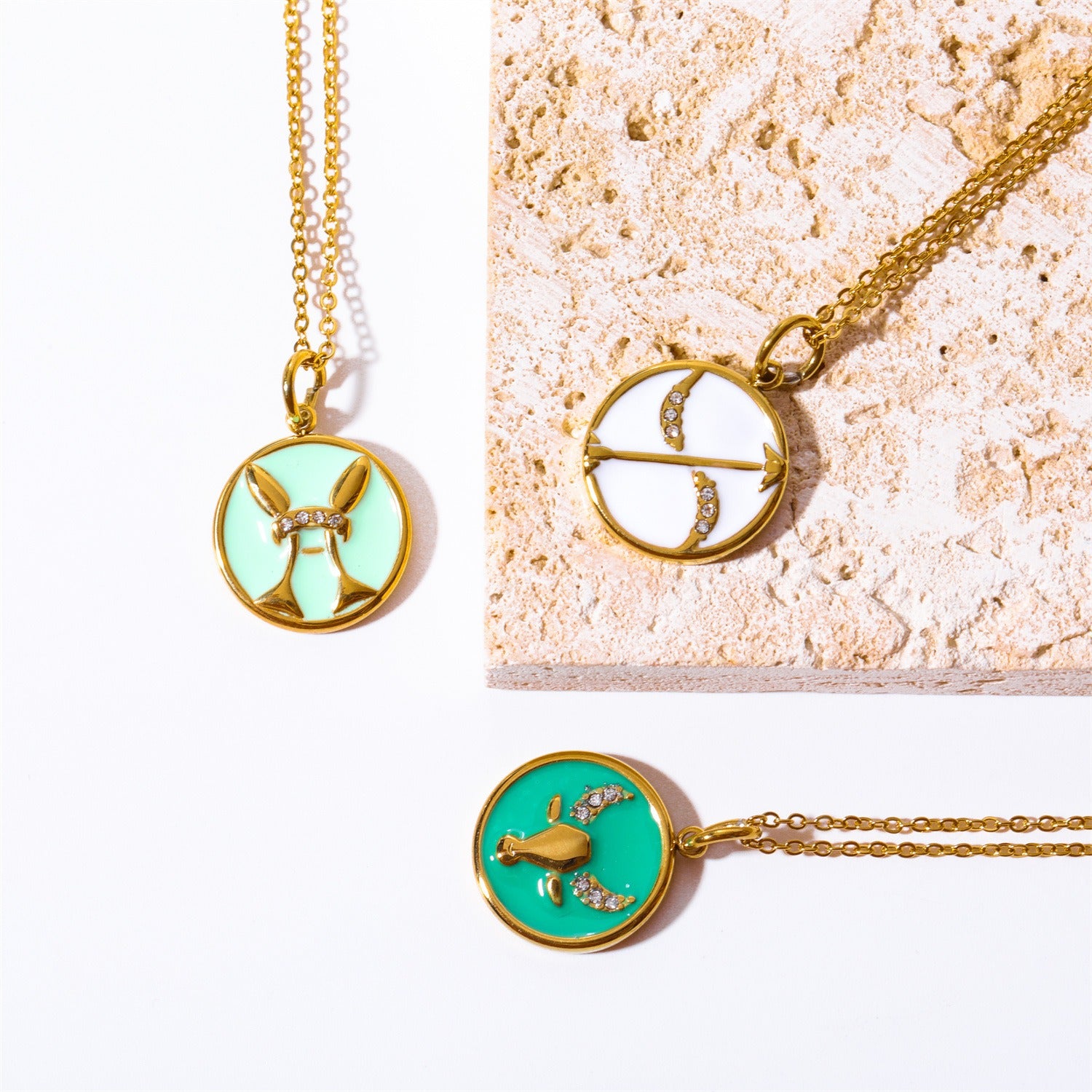 Green Taurus and white Sagittarius zodiac coin pendants vintage style gold jewelry.