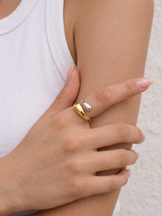 Model wearing the two-tone Gemini Sculptural Teardrop Ring on the hand
