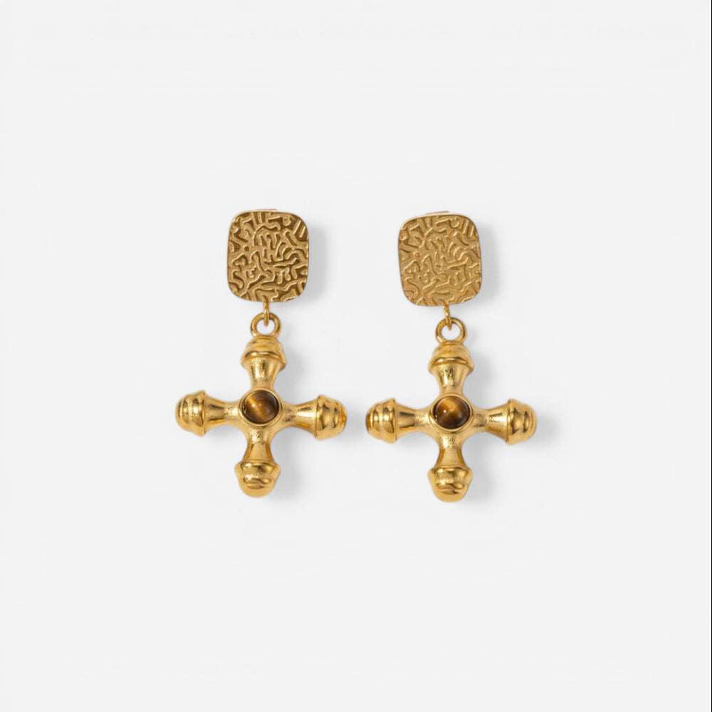 Pair of byzantine style gold cross earrings with amber brown center stone.