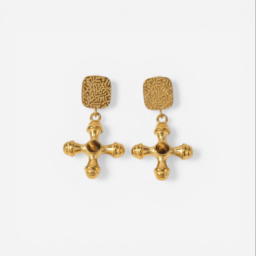 Pair of byzantine style gold cross earrings with amber brown center stone.