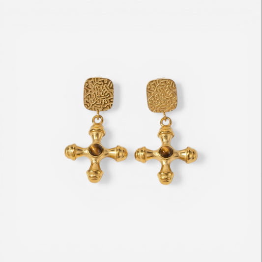 Pair of byzantine style gold cross earrings with amber brown center stone.