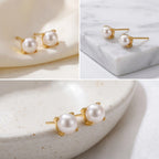 Aesthetic photography of dainty pearl earrings on stone, timeless classic jewelry gift, minimalist accessories for everyday wear.