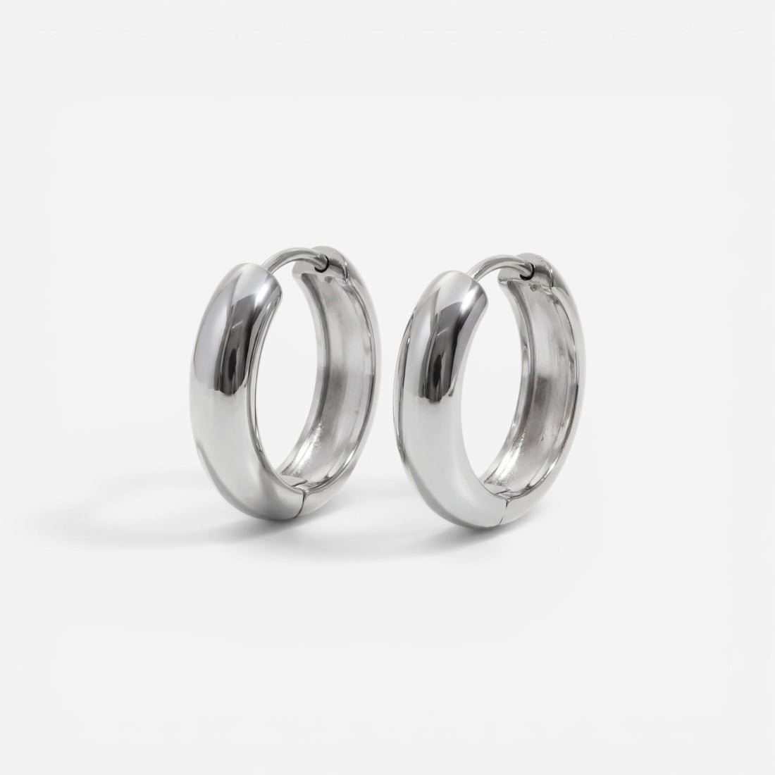 Silver chunky dome huggie earrings stainless steel minimalist design.