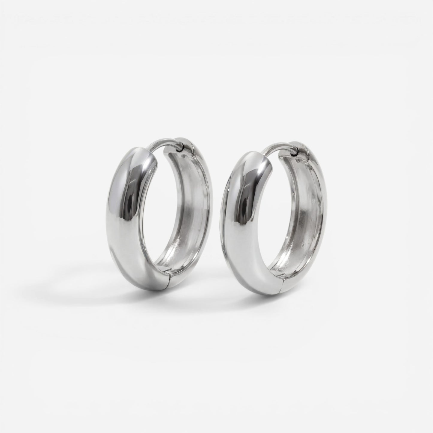 Silver chunky dome huggie earrings stainless steel minimalist design.