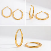 Detail shot of medium gold hoops everyday essential jewelry details.