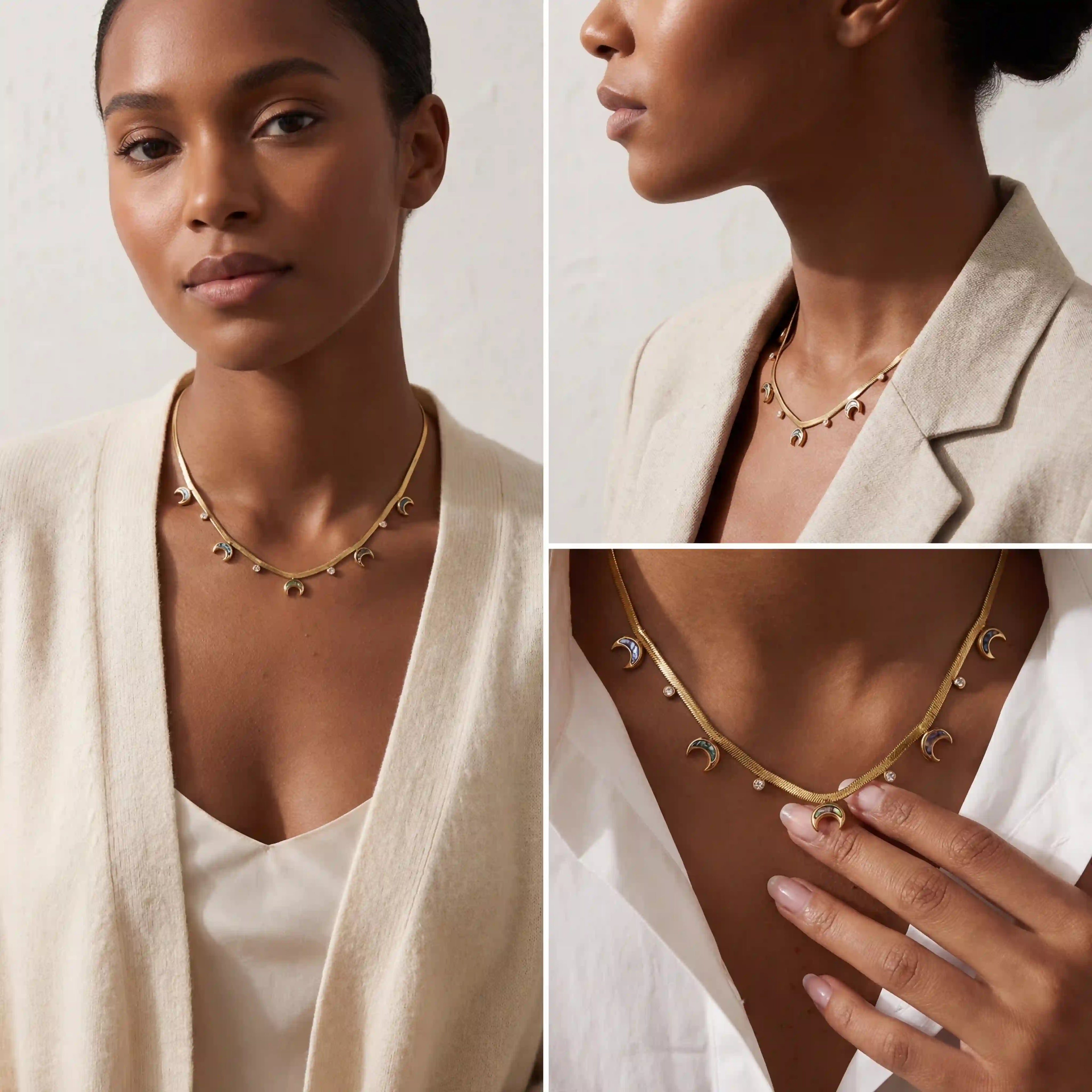 Model with dark skin wearing gold abalone crescent moon statement necklace with white blazer.