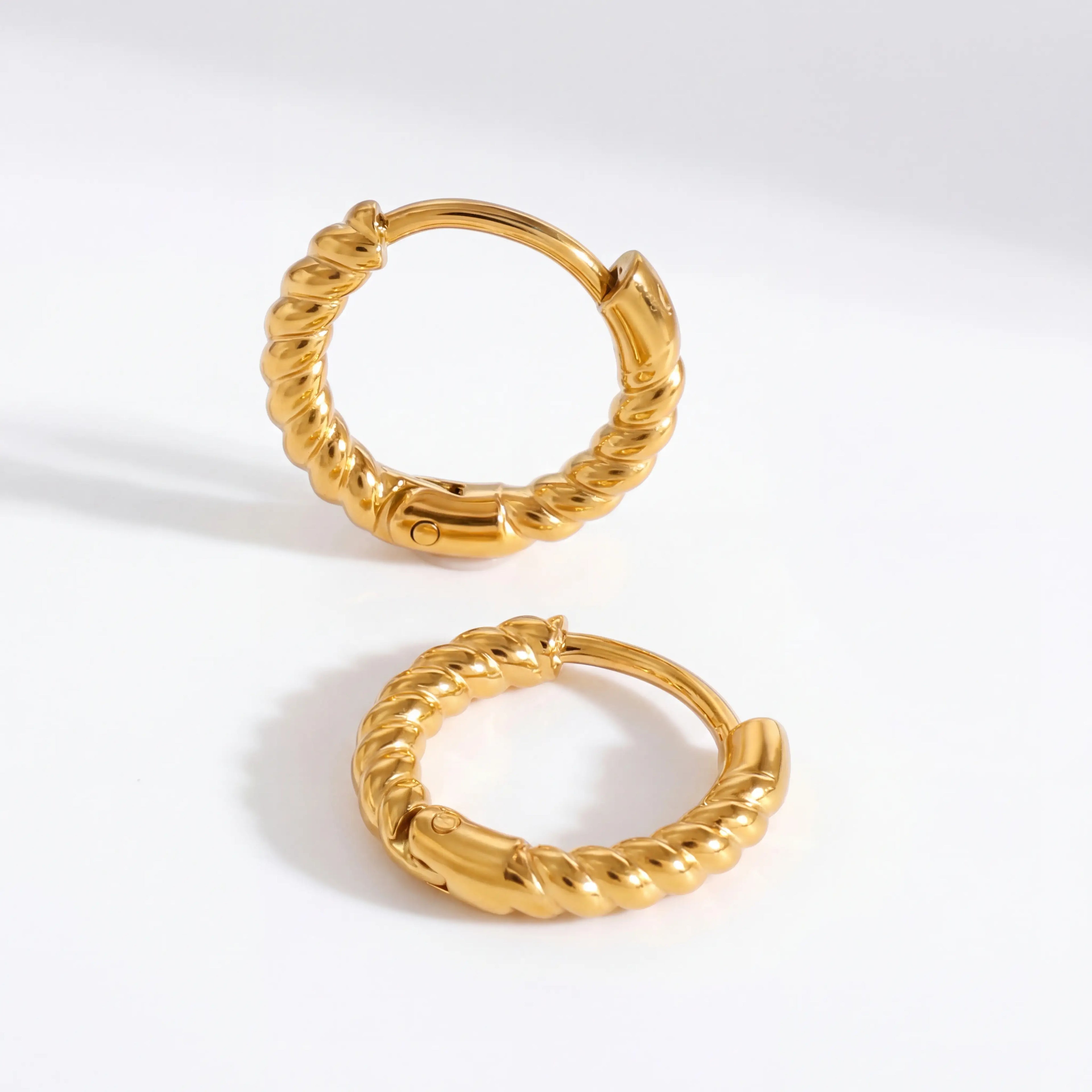 18k gold plated stainless steel twisted rope huggies, anti-tarnish small hoop earrings, textured minimalist jewelry isolated on white.