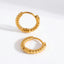 18k gold plated stainless steel twisted rope huggies, anti-tarnish small hoop earrings, textured minimalist jewelry isolated on white.