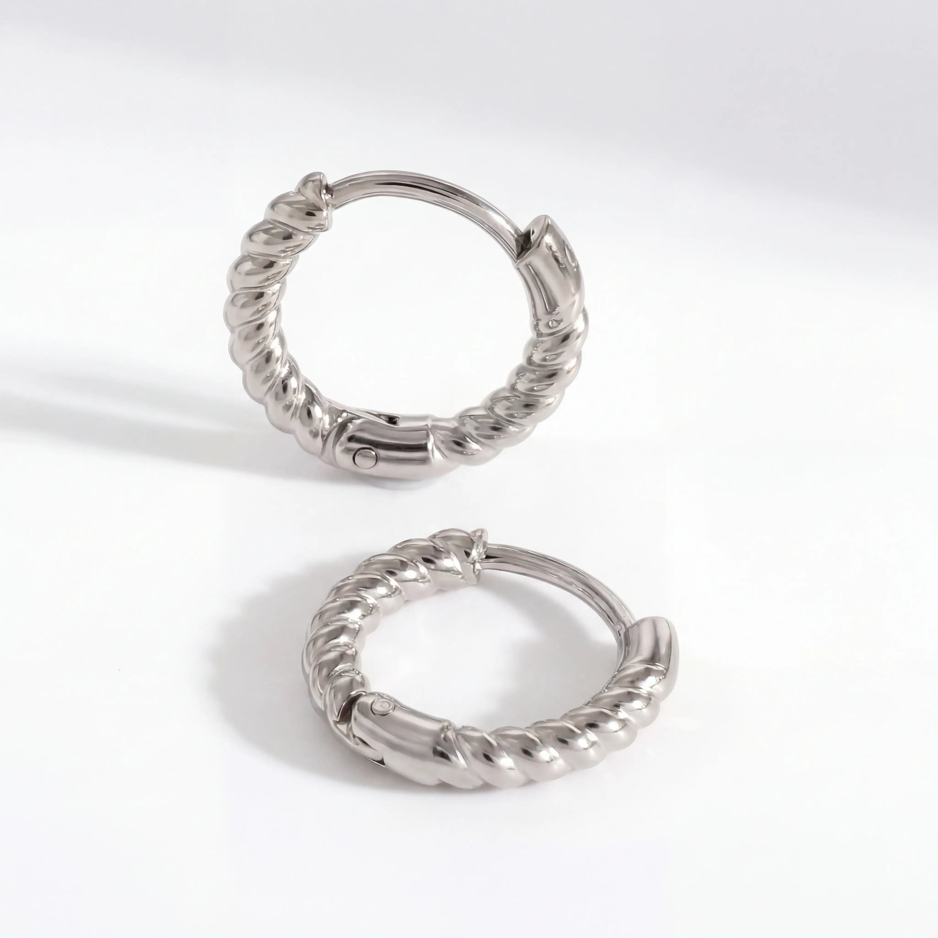 Silver stainless steel twisted huggie earrings, cool tone rope texture hoops, waterproof cartilage earrings for sensitive ears.