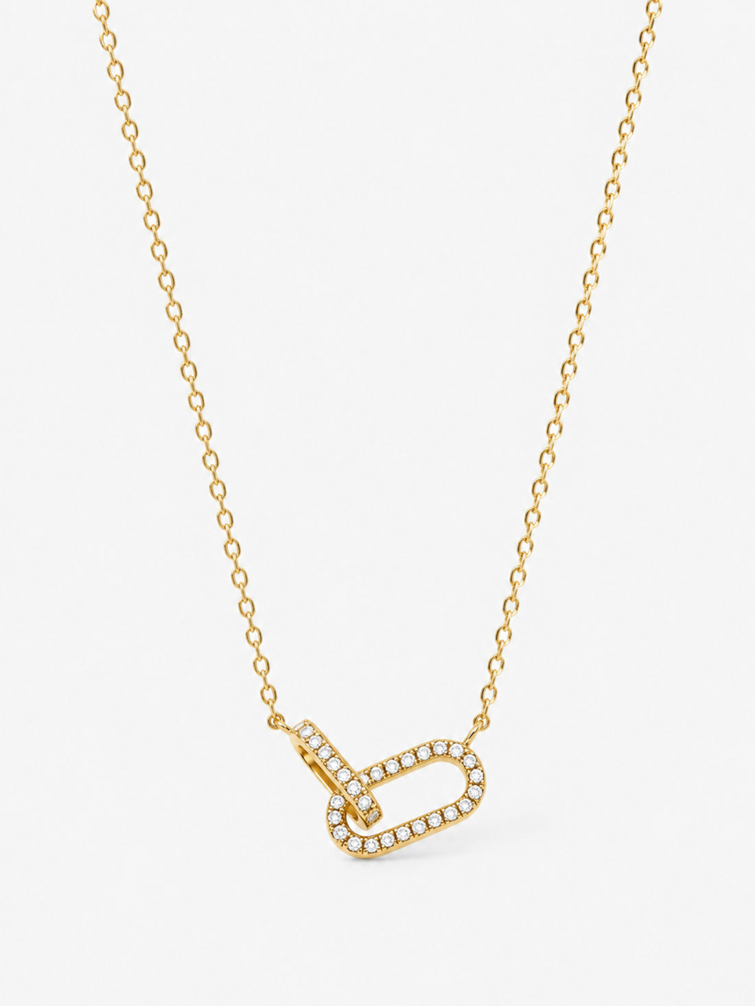 Sculpted Ribbon Heart Necklace in polished gold with clear zircon accents on a white background