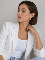 Sculpted Wave Huggie Hoop Earrings styled as everyday gold earrings