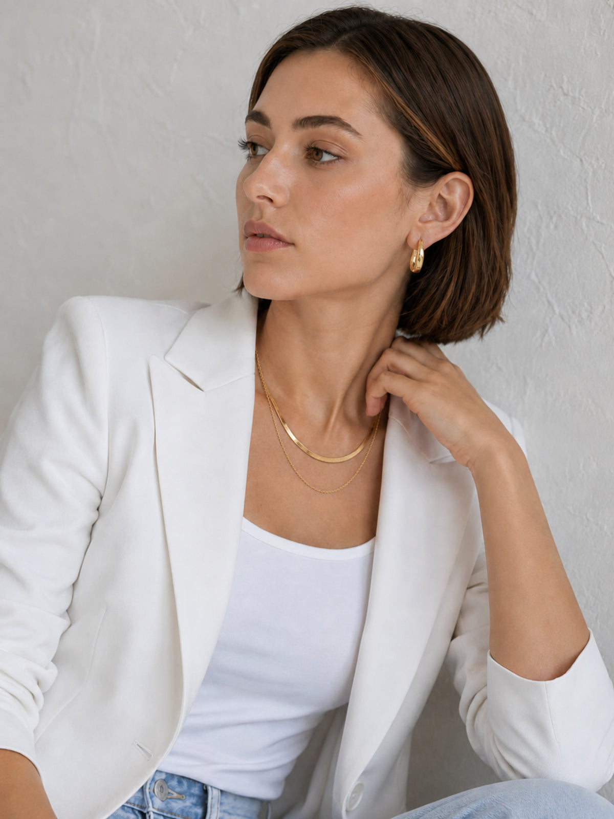 Sculpted Wave Huggie Hoop Earrings styled as everyday gold earrings