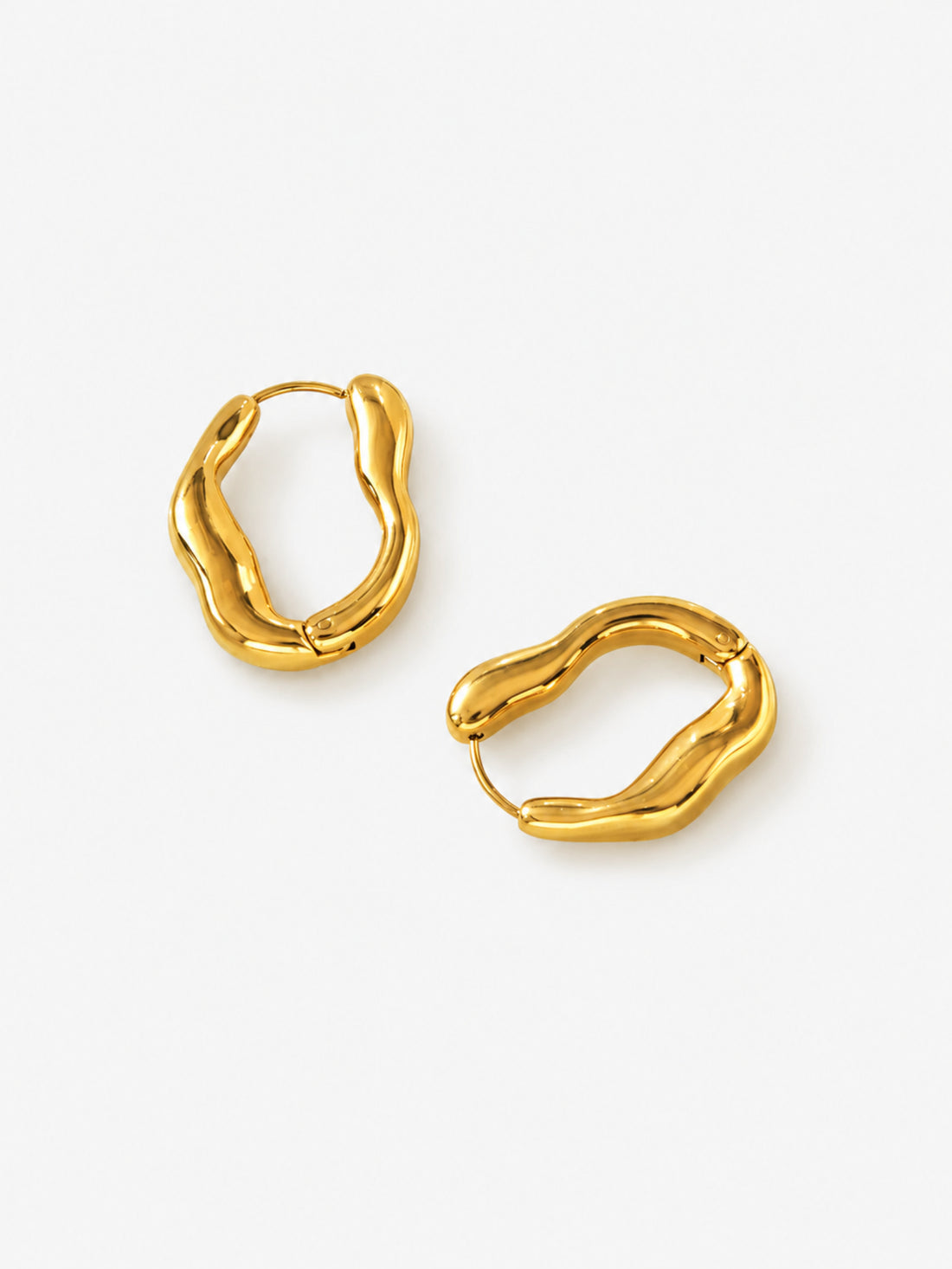 Side view of Sculpted Wave Huggie Hoop Earrings showing the sculpted wave profile