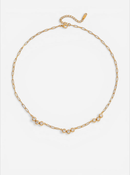 Gold paperclip chain necklace featuring three bezel set crystals waterproof stainless steel jewelry.
