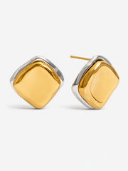 Gold sculptural stud earrings on white background