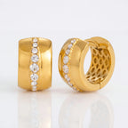 Pair of wide gold hoop earrings with central cubic zirconia line waterproof stainless steel.
