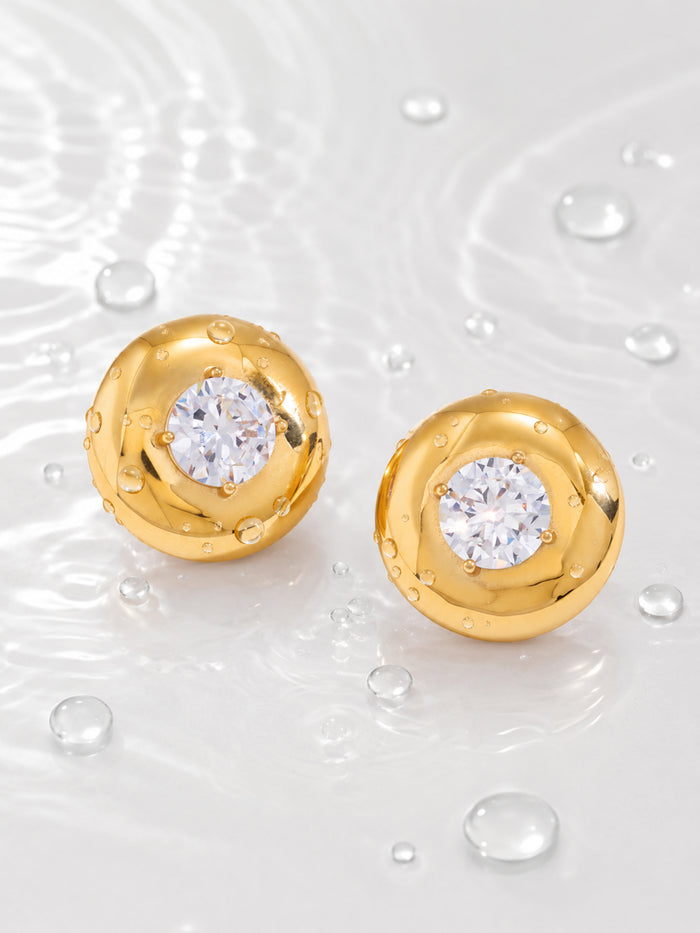 Vesta Bold Dome Studs with polished gold domes and round cubic zirconia centers