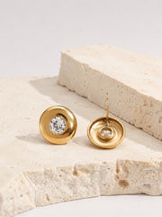 Close-up of Vesta Bold Dome Studs showing rounded gold domes and cubic zirconia centers