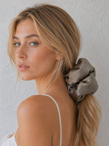 Model wearing Form Silk Pillow Scrunchie in Mushroom Taupe