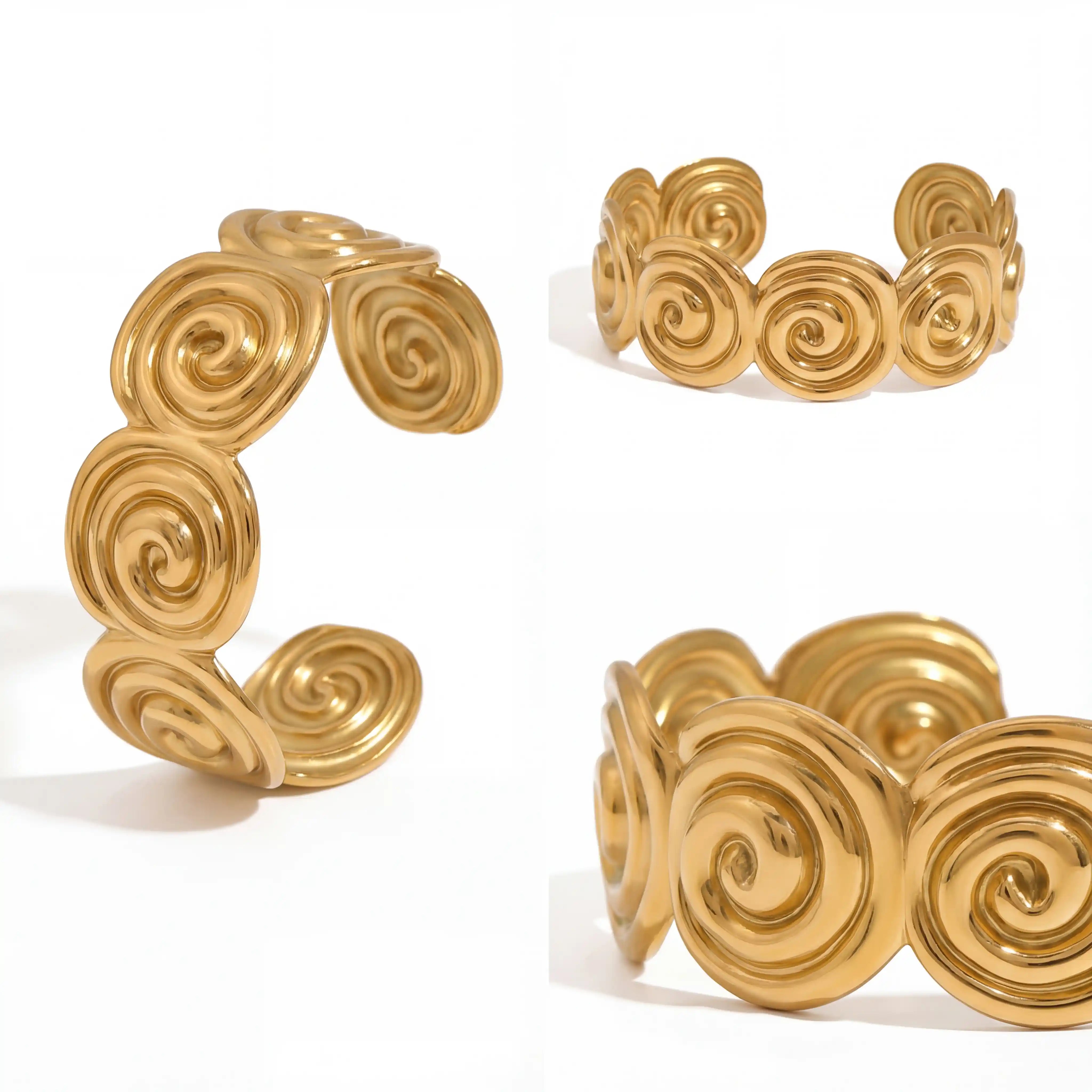 Multiple angles of abstract swirl open cuff bracelet gold pvd.