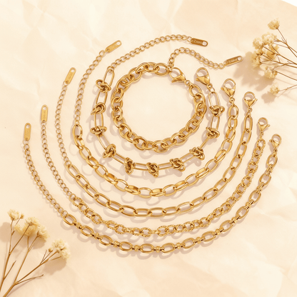 The complete Amalfi Layering Set with all six gold bracelets arranged in elegant concentric circles, displaying the full collection of tarnish-free chain styles.