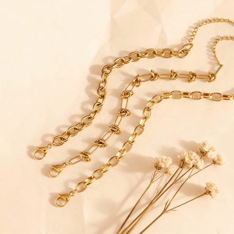 he three boldest and chunkiest chain bracelets from The Amalfi Layering Set laid out to feature their unique, statement-making link designs.