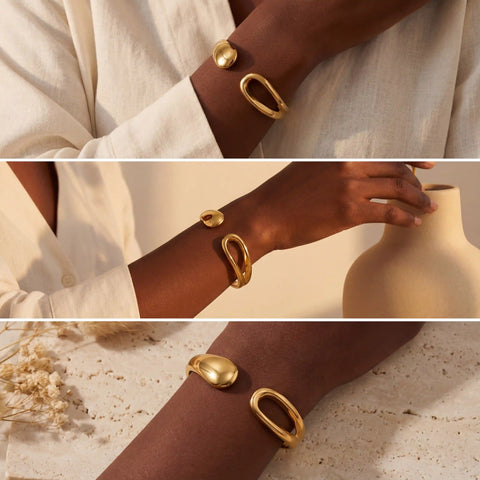 Fashion photography mood board of gold statement bangle on dark skin model.