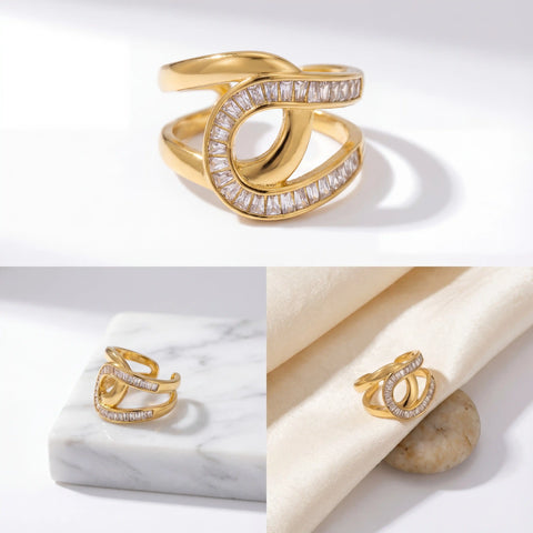 Aesthetic flat lay of luxe gold statement ring with channel set cubic zirconia on marble.