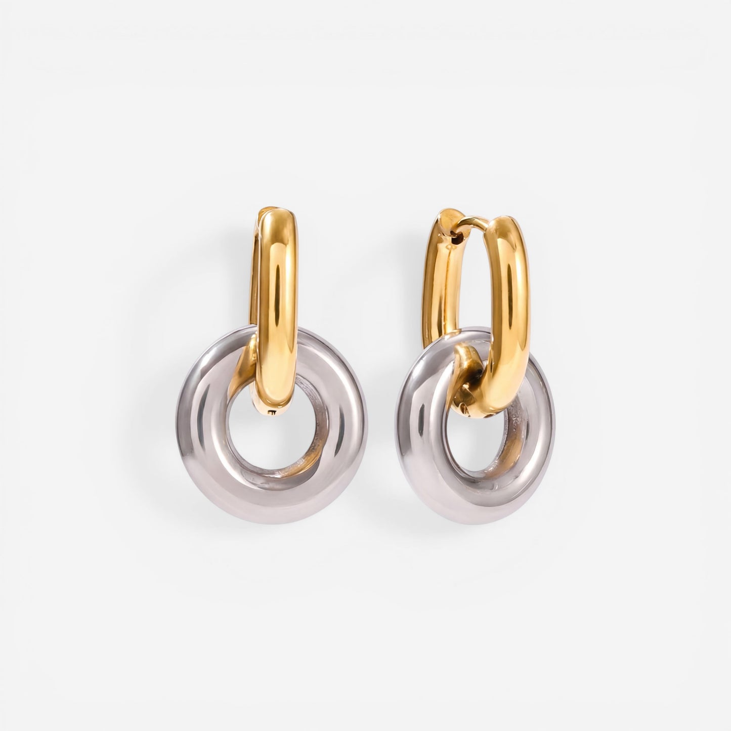 Mixed metal two-tone gold and silver twist knot earrings modern design.